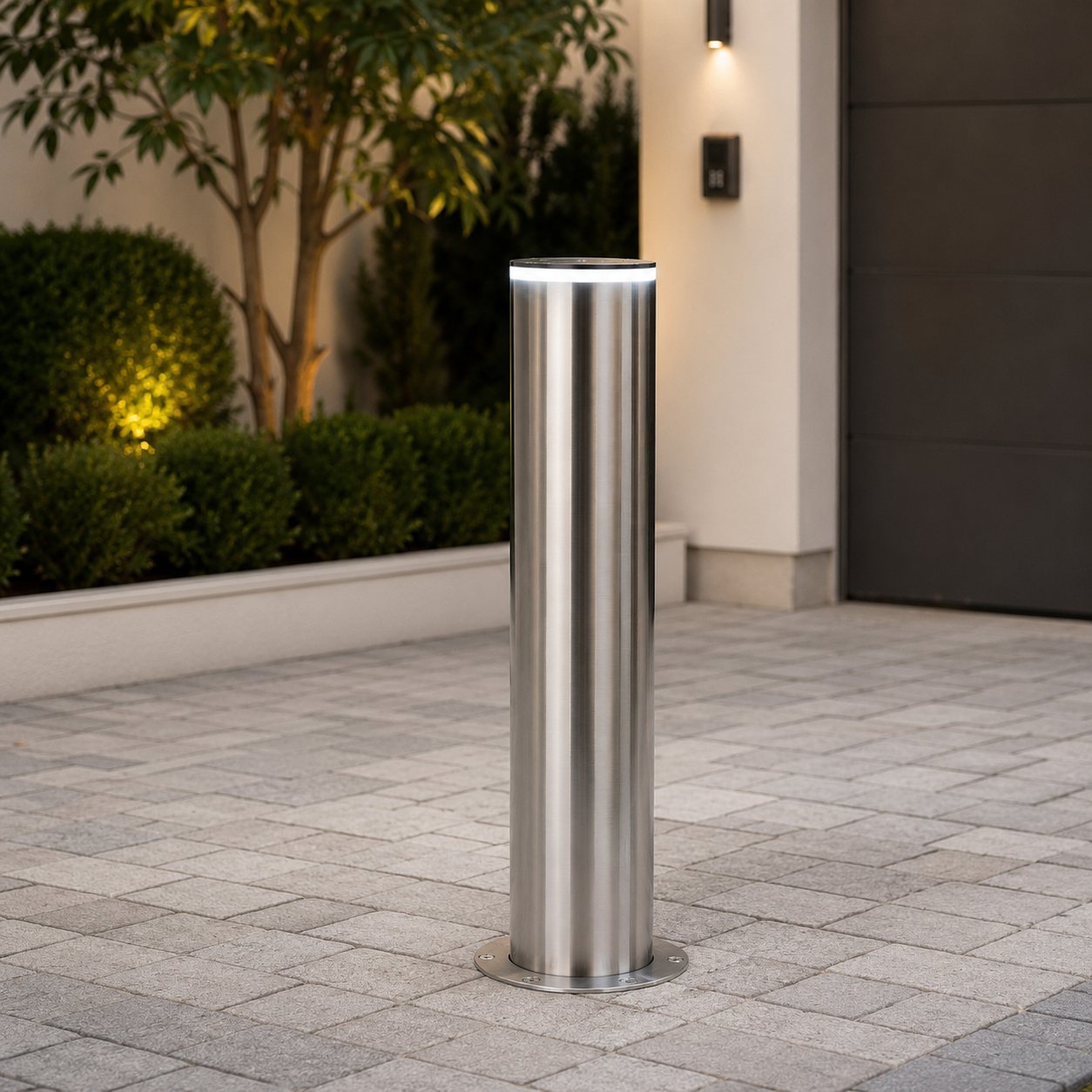 Bollards at a wider modern entrance, spaced across the opening.